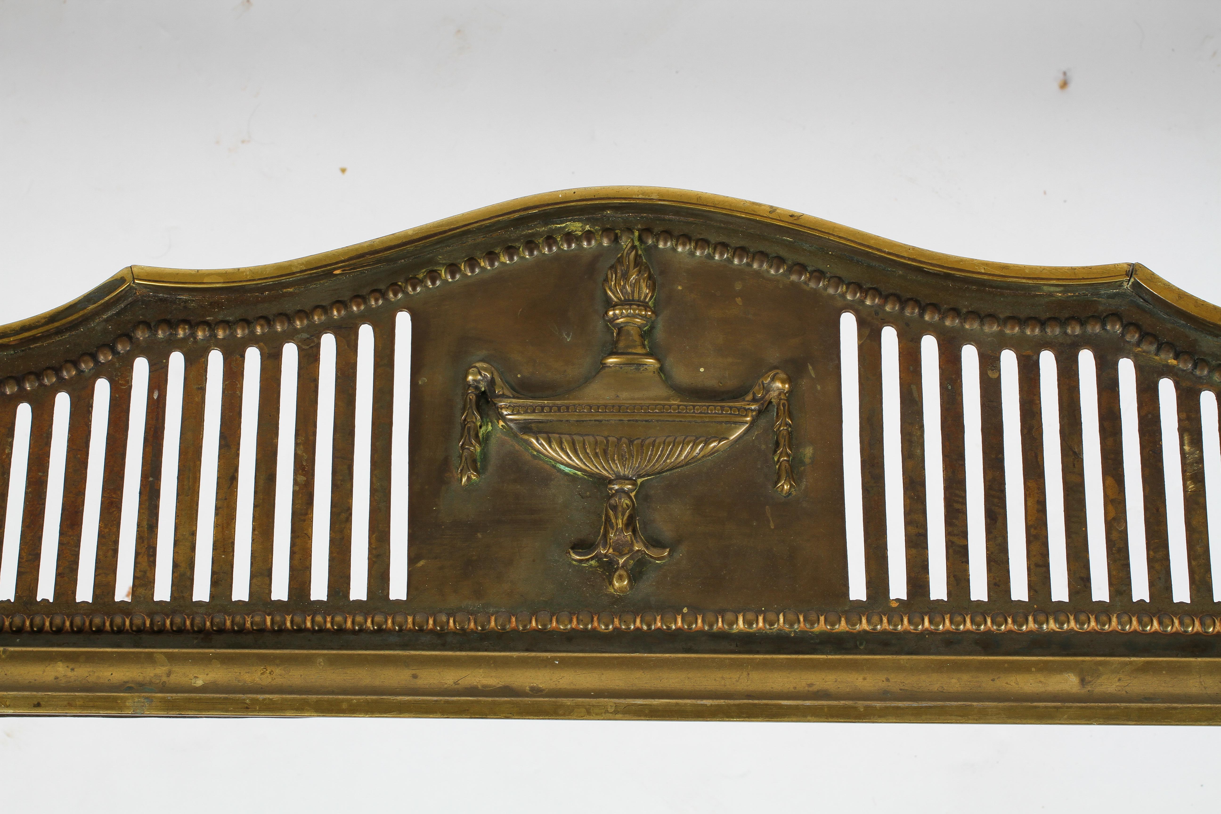 A neo-Classical brass fender, a central urn surrounded by slender pierced decoration, - Image 2 of 2