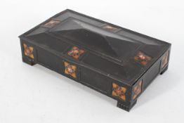 A Players Navy Cut Cigarette Arts and Crafts style tin, with ebonised and flower head decoration,