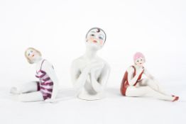 Two Continental porcelain bathing belles, and an Art Deco style pin doll bust,