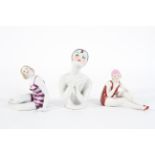 Two Continental porcelain bathing belles, and an Art Deco style pin doll bust,