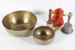 Two Tibetan or Chinese singing bowls, one with chased decoration,