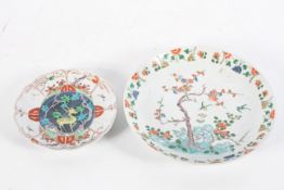 A Chinese Kaliemon style saucer dish, probably 19th century, enamelled with a prunus before a rock,