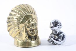 A brass car mascot, cast as a Native American Indian chief's head,