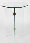 A modern glass occasional table, the octagonal top on a cross section base,