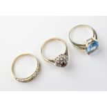 A collection of three dress rings of variable styles.