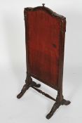 A Victorian stained oak rise and fall fire screen, late 19th century,