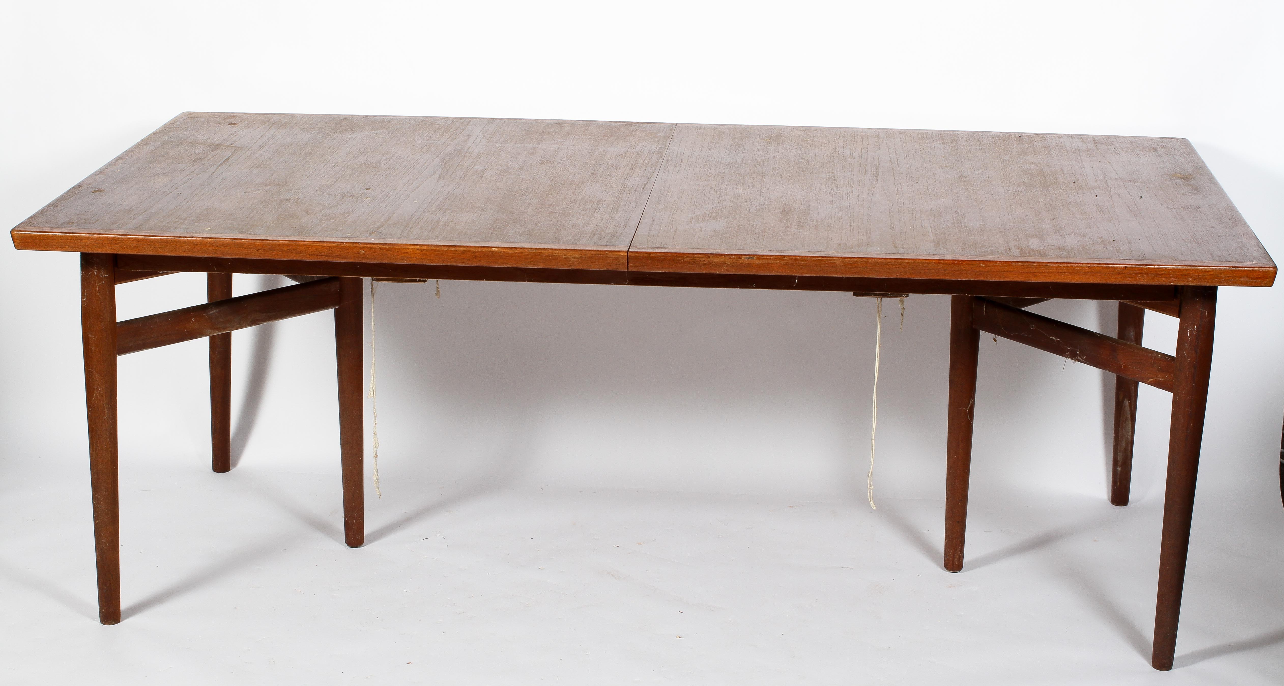 An Arne Vodder for Sibast Mobler teak extending dining table, of bowed rectangular form,