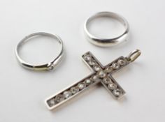 A yellow and white metal cross pendant set with old European cut diamonds of variable sizes