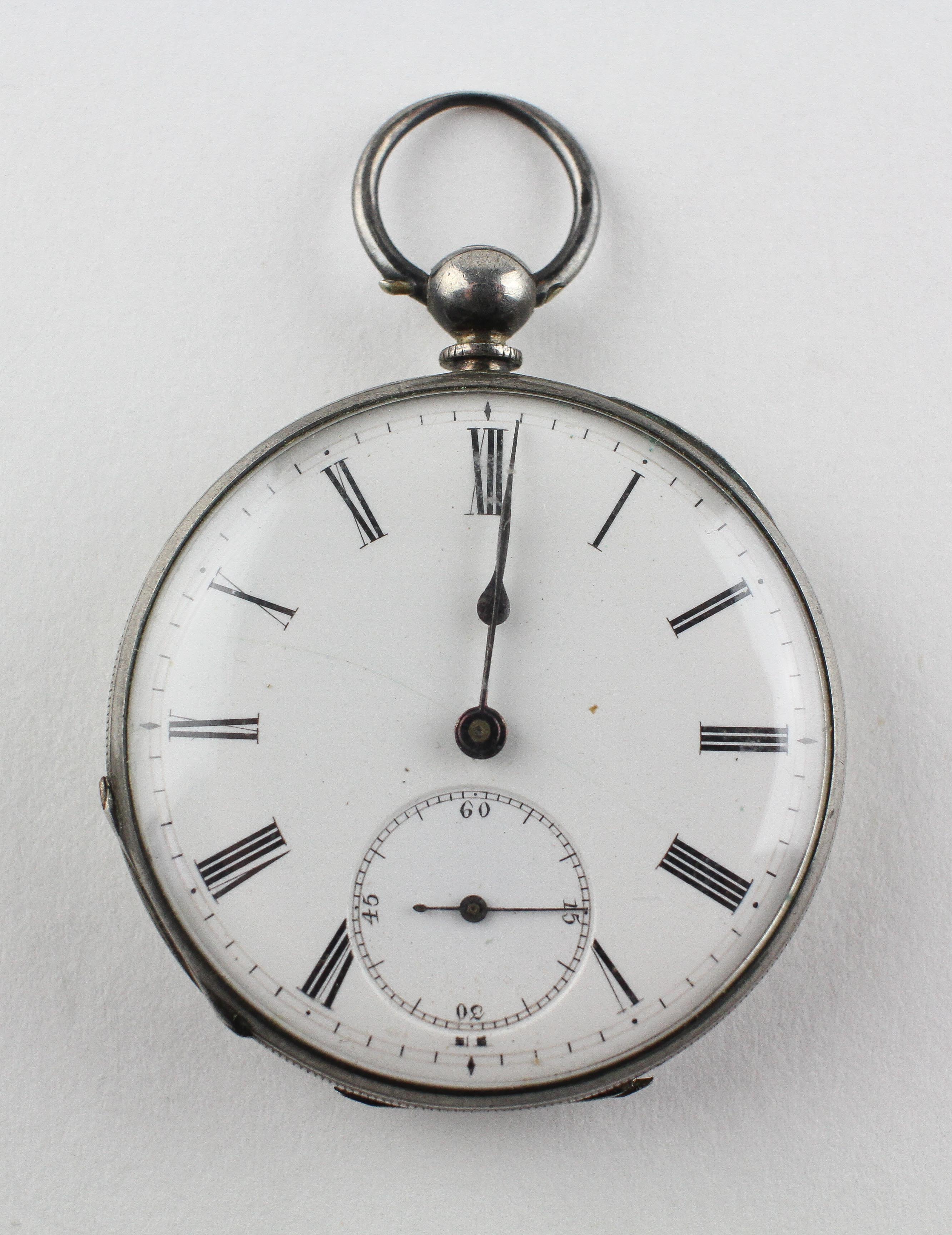 An open face pocket watch. Circular white dial with roman numerals. Key wound movement.