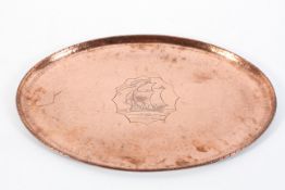 An Arts and Crafts style hammered copper oval tray, by Hugh Wallis,