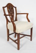 A Hepplewhite style mahogany elbow chair, with a shield shaped back,