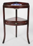 A 19th century mahogany corner washstand, with a low gallery,