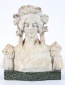 A white marble bust of a young lady wearing a lace bonnet, on a mottled green marble base,