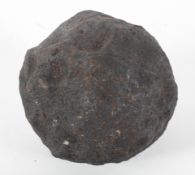 An iron cannon ball, 14cm diameter Provenance : Recovered from Plymouth sound,