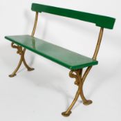 A bench, possibly from a tram, with painted wood back rest and seat,