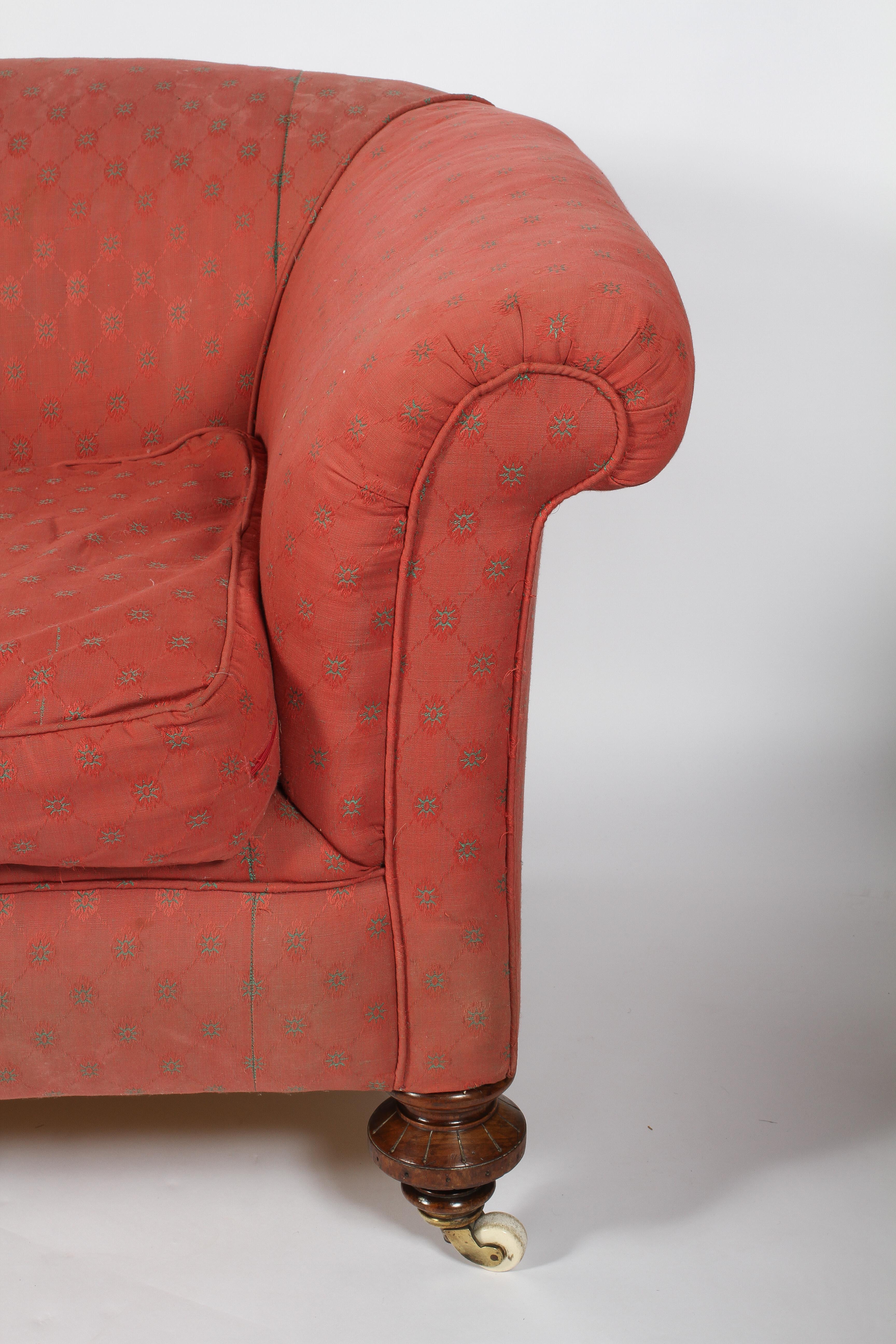 A 19th century Chesterfield two seat sofa, upholstered in red, with two drop-in cushions, - Image 2 of 3