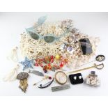 A large collection of costume jewellery to include nine brooches, A large abstract pendant,