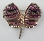 A large yellow and rose metal butterfly brooch