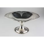 A George V silver comport, the oval bowl with foliate pierced border, maker's mark HA,