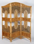 A bamboo and wicker three fold screen, 20th century, with stylised radiating foliate panels,