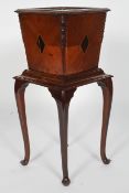 An Edwardian walnut jardiniere,