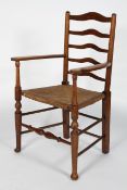 An oak and elm Arts and Crafts style arm chair, the wavy ladder back above scrolled arms,