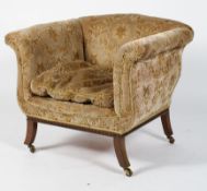 An Edwardian arm chair, with floral velour upholstery,