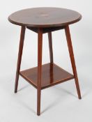 An Edwardian mahogany and satinwood inlaid circular occasional table, with a central patera,