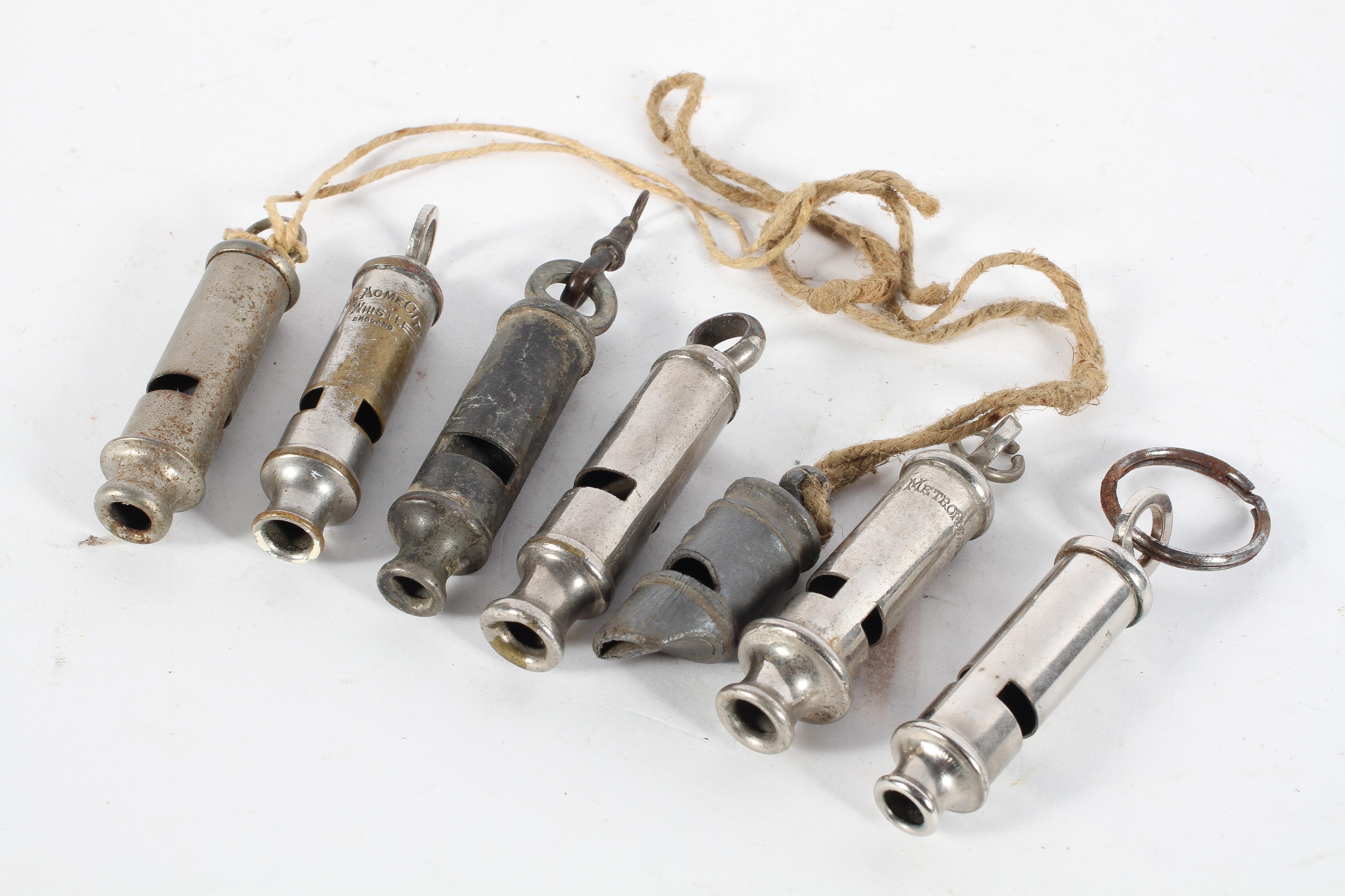A collection of seven whistles, including The Metropolitan,