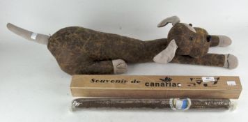 A leather draught excluder in the shape of a 'sausage dog' and a novelty cigar