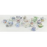 A collection of miniature teapots, by 'Porcelain Art',