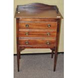 A mahogany filing cabinet with three drawers,