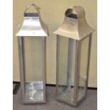 A pair of large metal and glass panelled planters,