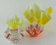 Four 1960's coloured glass napkin bowls,