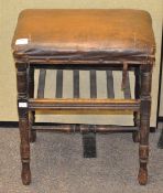 An upholstered 'Rexin' early 20th century foot stool,