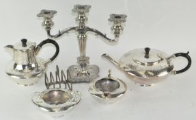 Silver plated wares to include a three branch candleabra, toastrack,