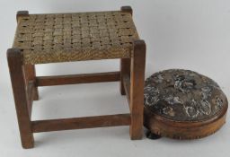 A Victorian footstool with embroidered beadwork top, raised on three bun feet, 28cm diameter,