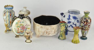 A collection of ceramic vases, including Worcester and Derby,