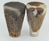 Two African tribal drums with cow hide decoration,