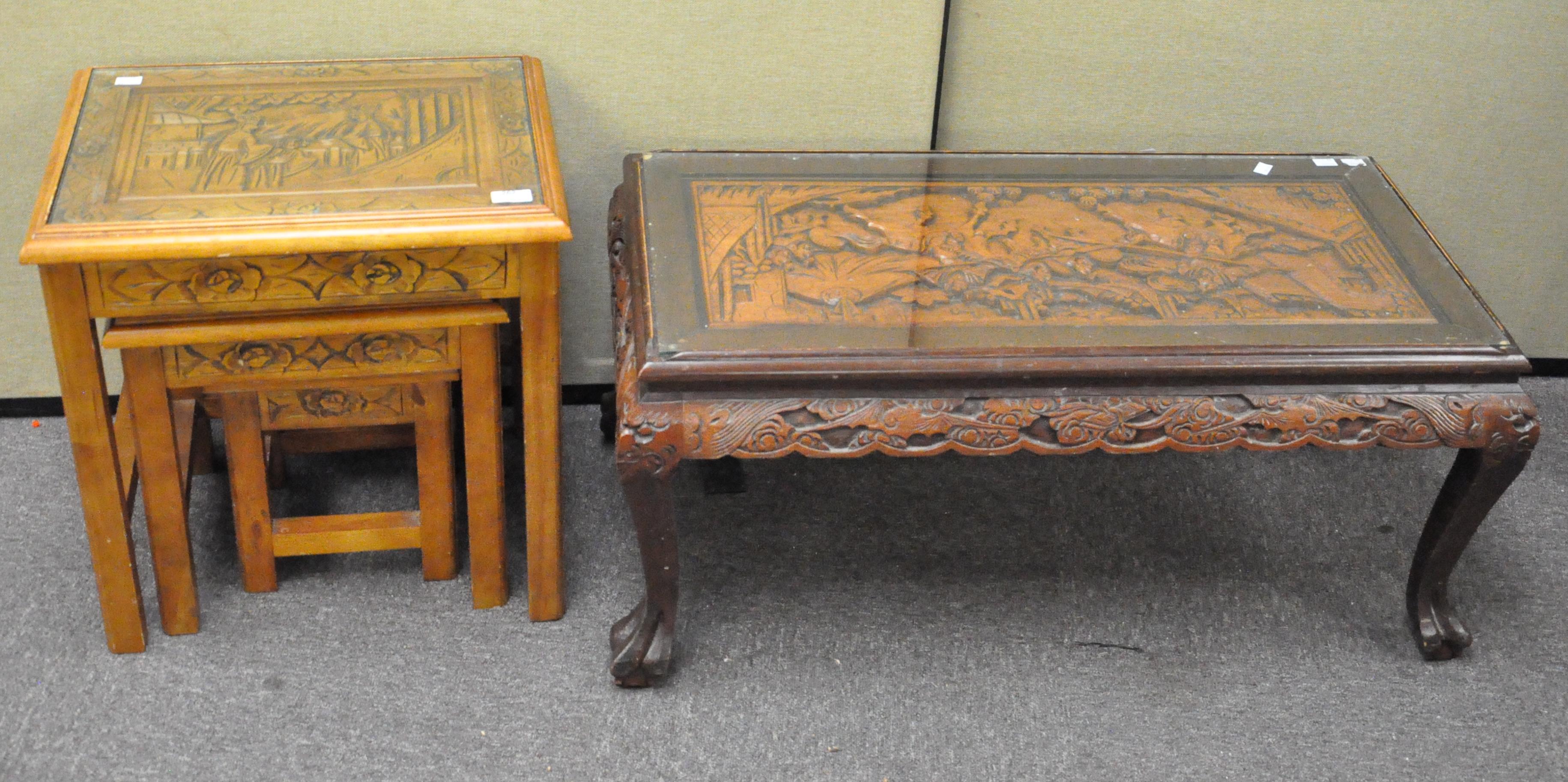 A nest of three oriental tables with a long similar coffee table,