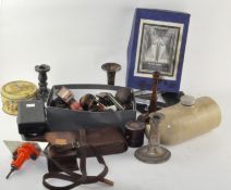 A collection of mixed items, including tools,