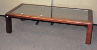 A large glass topped sofa table,
