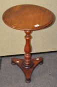 A late 19th century mahogany wine table of circular form,