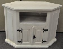 A vintage white painted hall cupboard with single shelf over a two door cupboard to front,