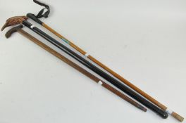 A group of three vintage walking sticks,