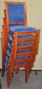 A set of six blue upholstered stacking chairs,
