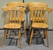 A set of four kitchen dining chairs,
