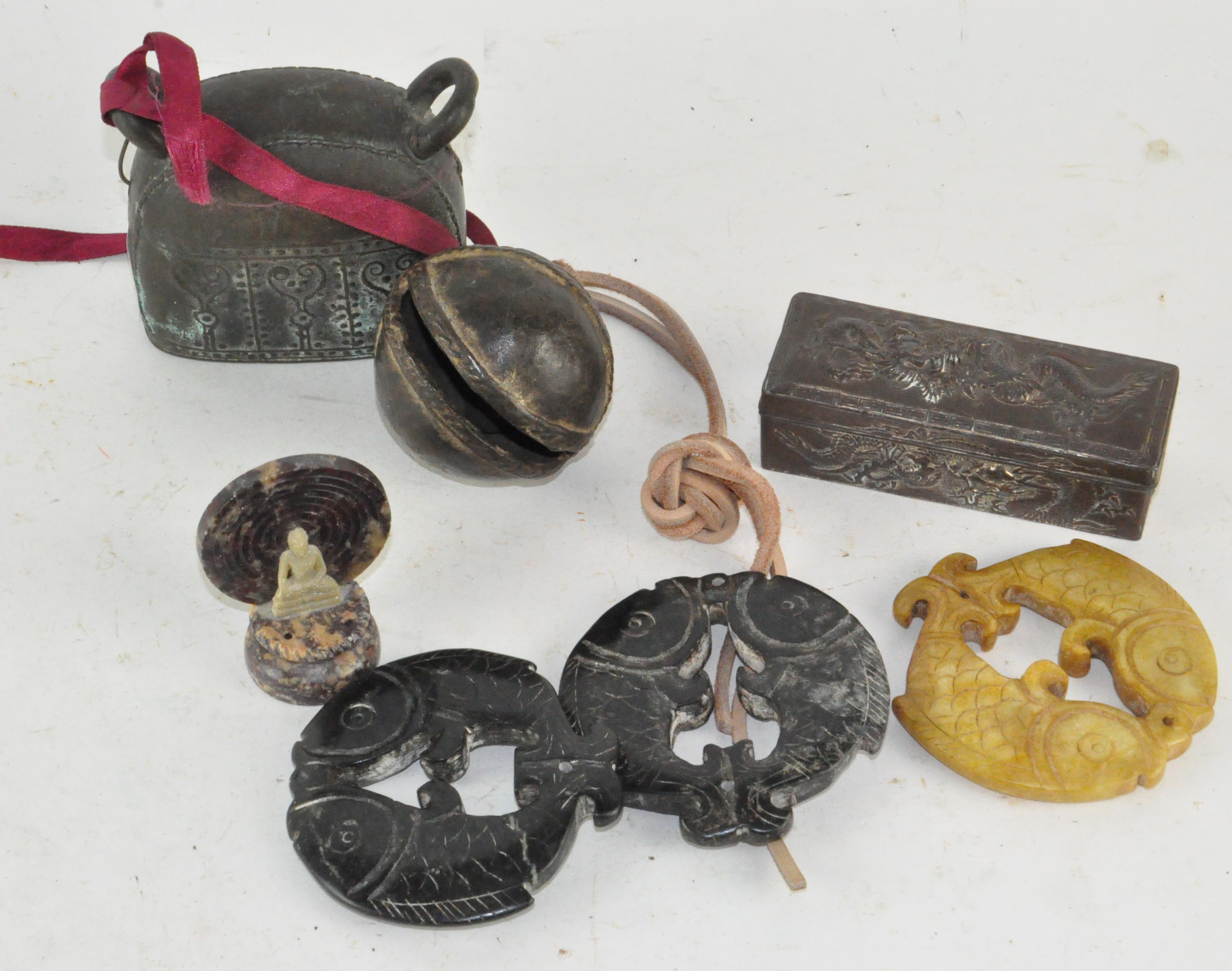 A group of Oriental items, including carved stone fish,