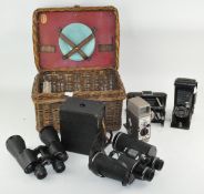 A collection of cameras, seven in total,