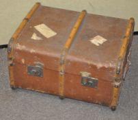 An unusual metal and leather bound steamer trunk;